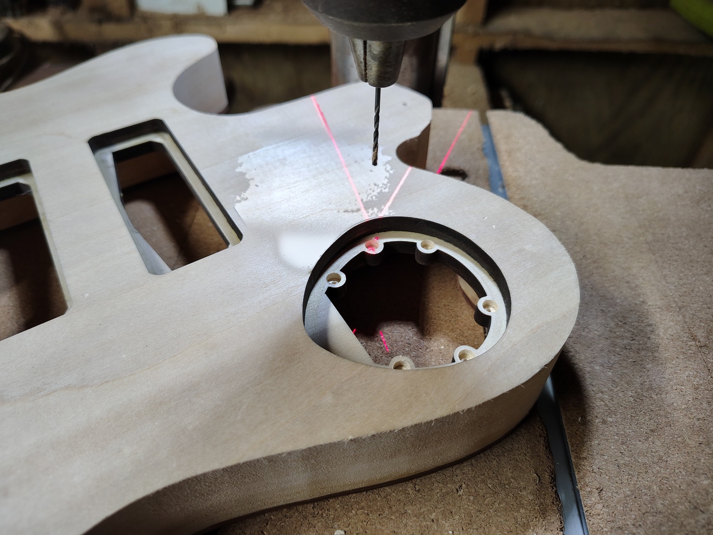 Drilling holes in center of
                magnet recesses