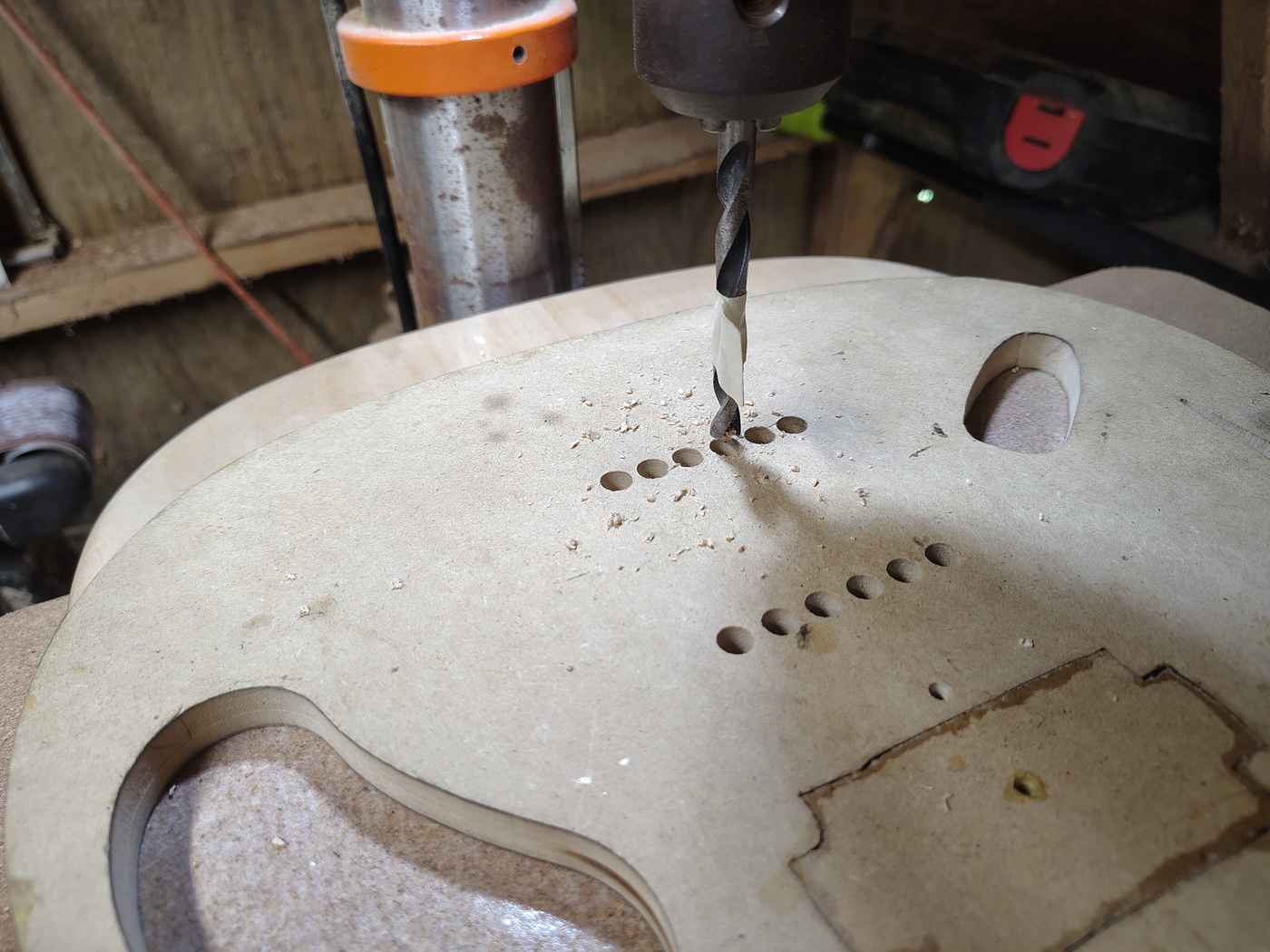 Drilling the string ferrule
                  holes using a template