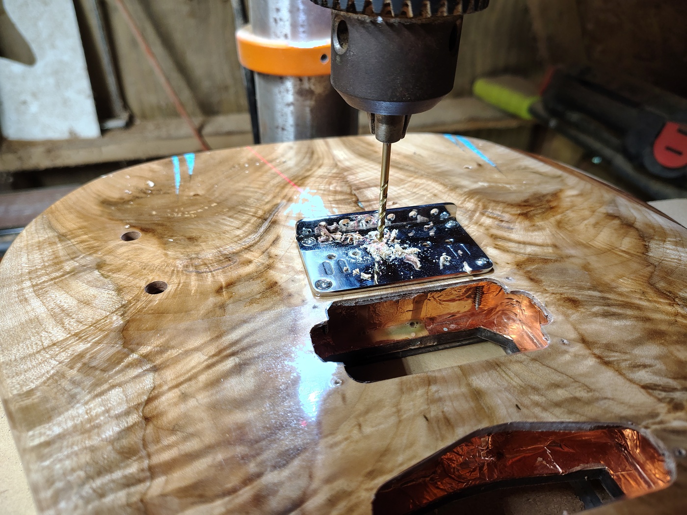 Using the bridge as a guide to
                drill string through body holes