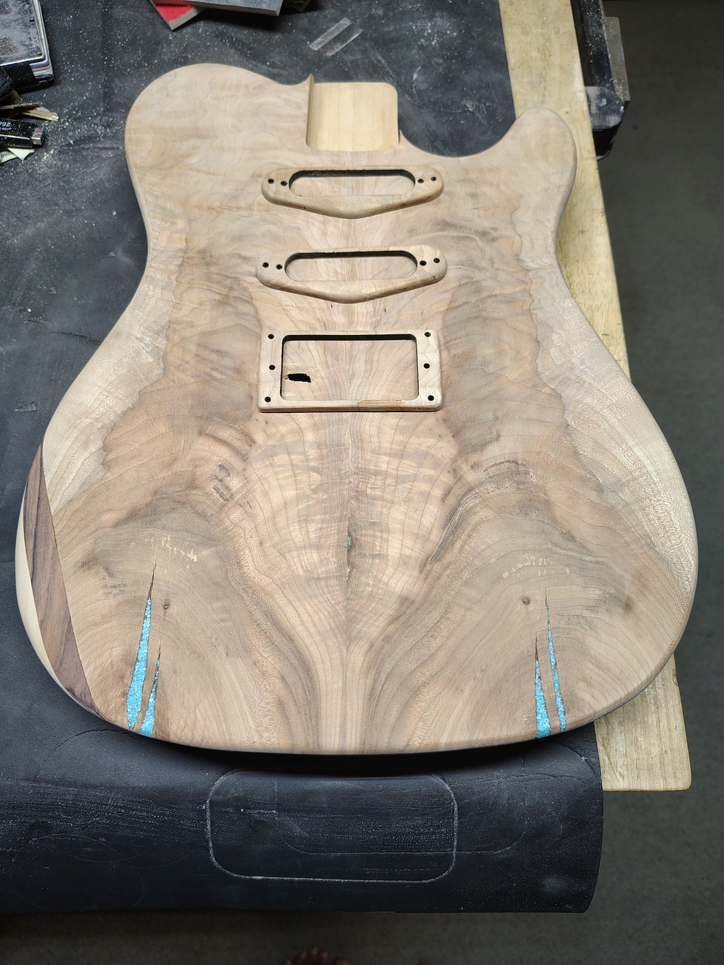 Top of the guitar with arm
                  cut and pickup mounting rings