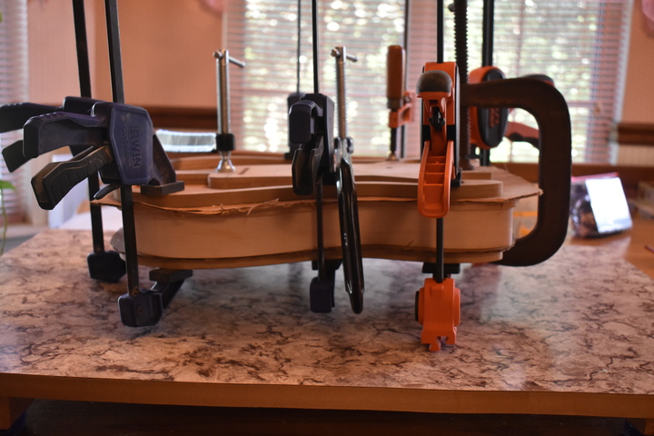 Top clamped to body