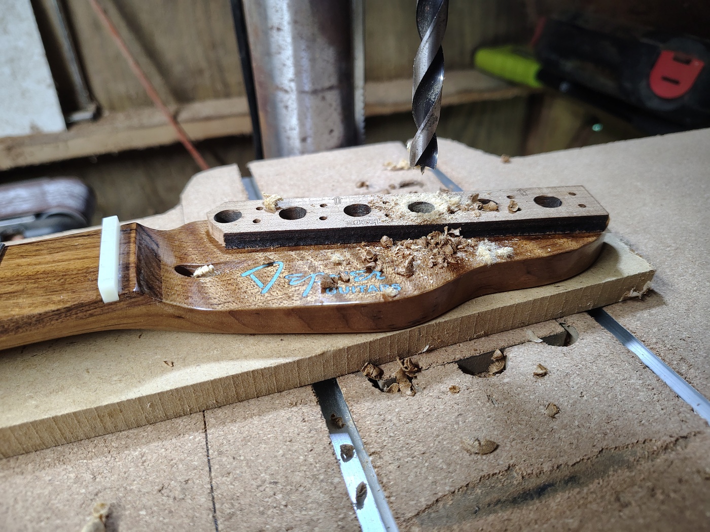 Drilling
                the tuner holes