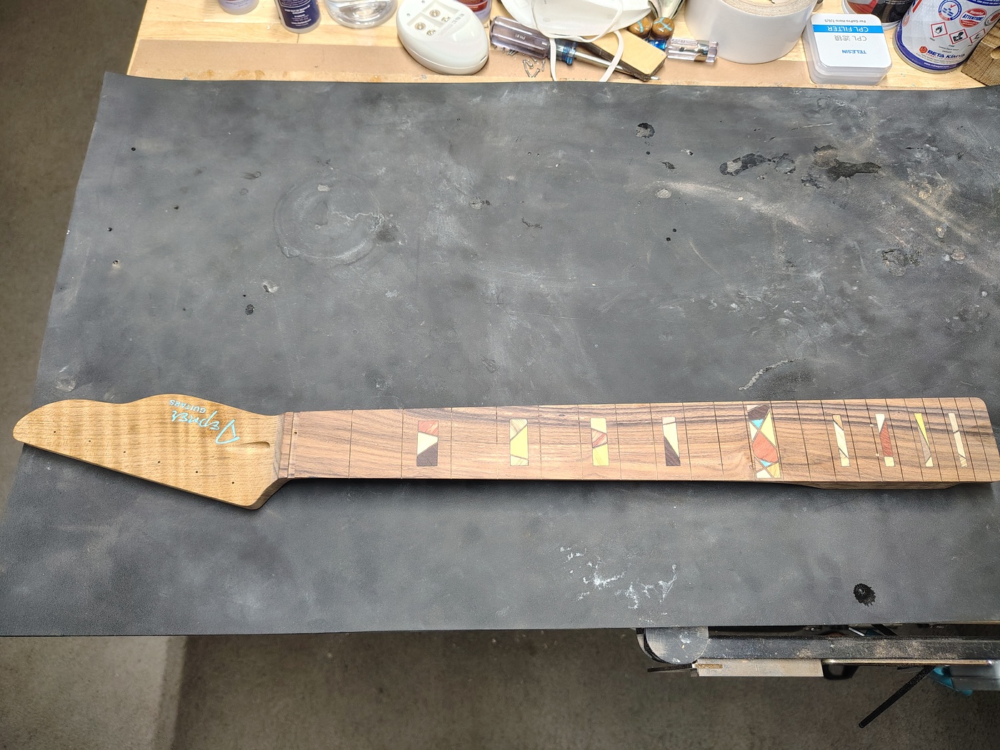 Neck with
                radiused fretboard