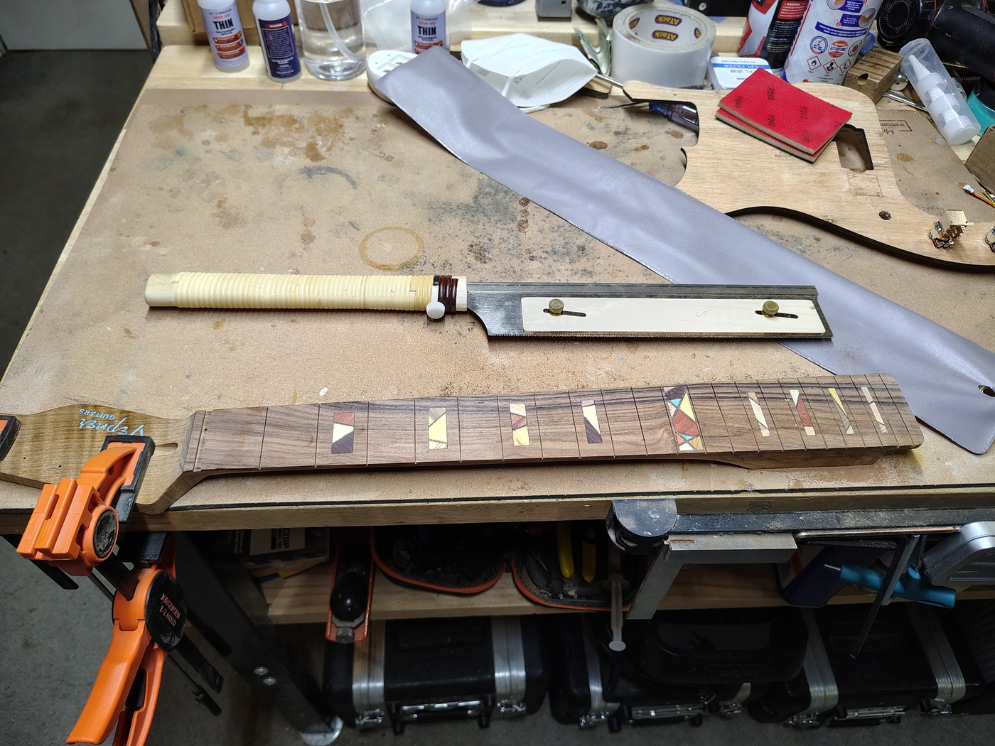 Fretboard withJapanese fret saw after re-sawing the
                frets