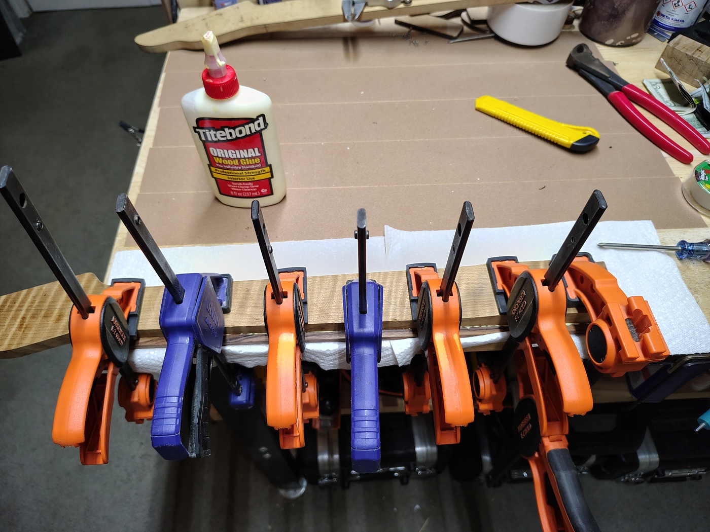 Neck and fretboard clamped together