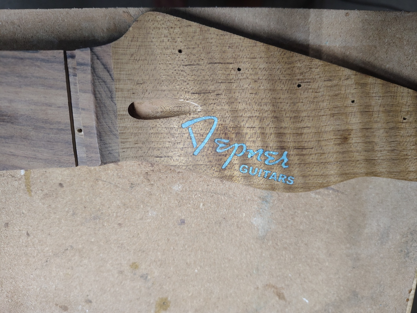 Peghead
                logo after sanding