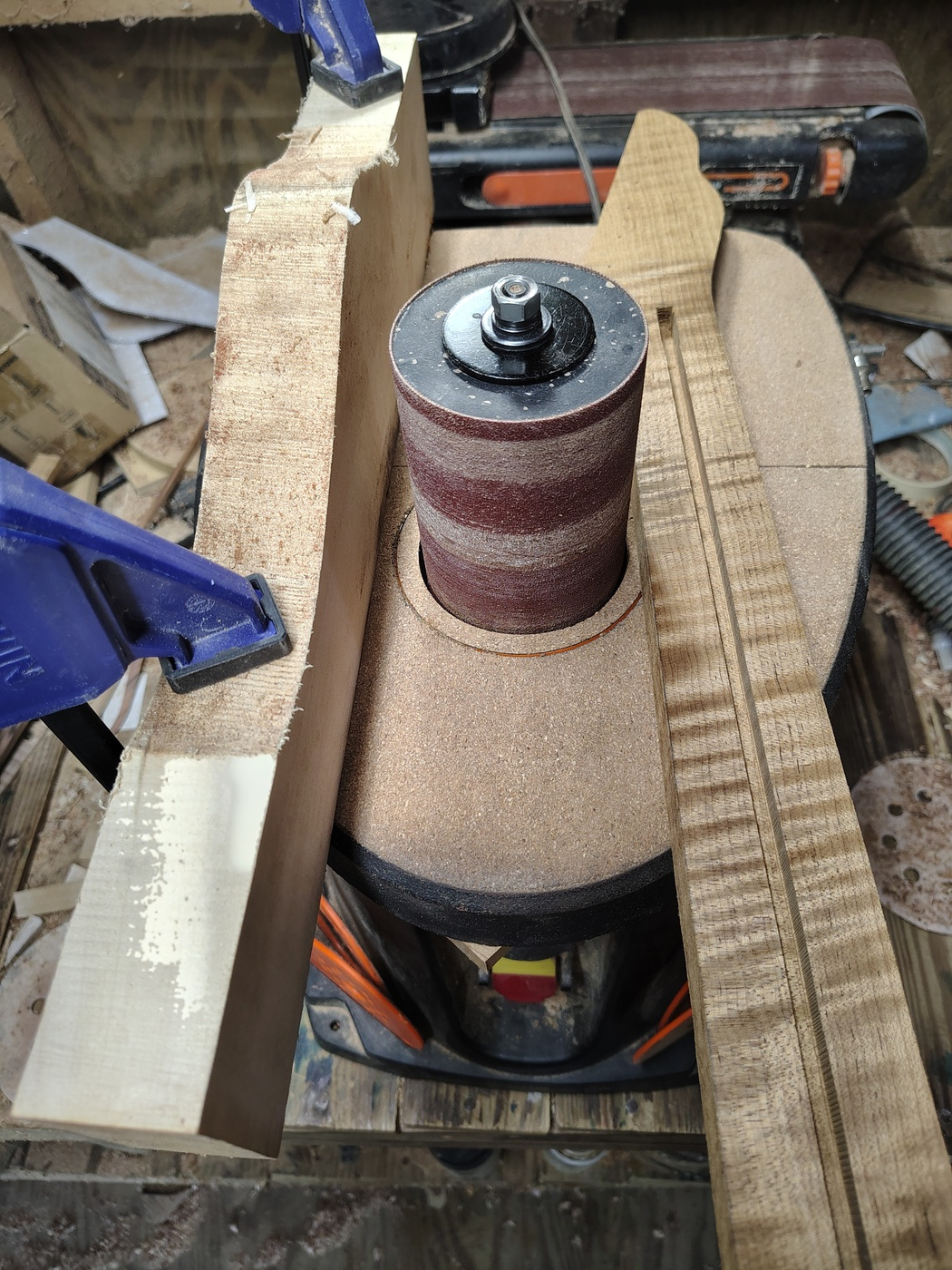 Thicknessing the peghead with the oscillating drum
                sander