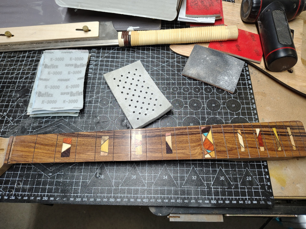 Fretboard sanded to
                K3000